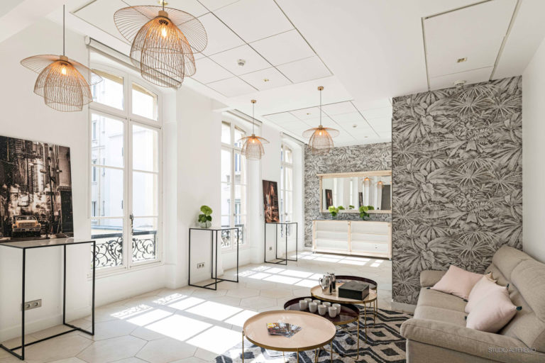 The Studio at Le Cercle d’Aumale, a bright room with botanical wallpaper